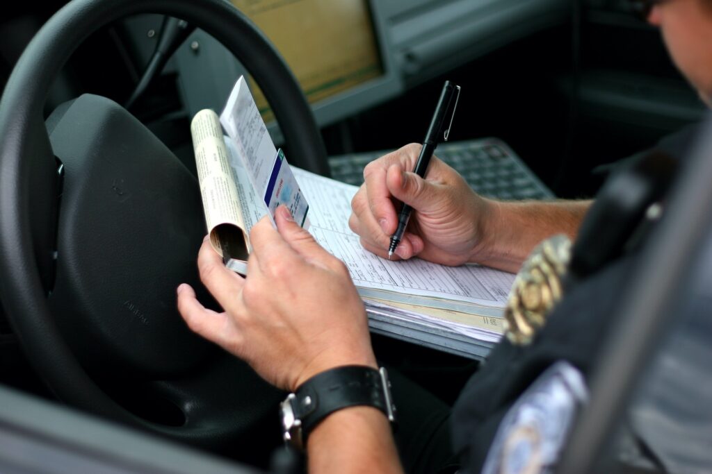 Officer writing traffic ticket